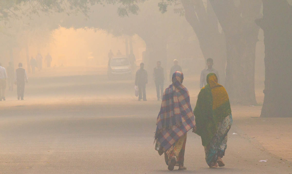Daily street life in the early morning during extreme smog conditions, in New Delhi, India in 2012. (Photo courtesy of iStock/Getty.)