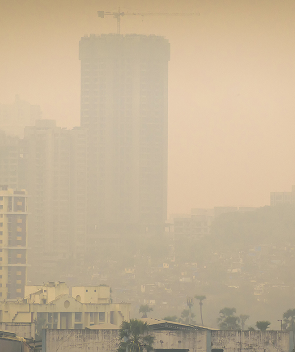 Mumbai, Maharashtra, India - October 2019: High air pollution and haze envelops the high rises in the suburb of Kandivali East. (Photo courtesy of iStock/Getty.)
