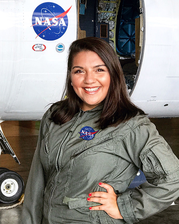 Castillo in front of a research aircraft at NASA’s Langley Research Center. (Photo courtesy of Ariana Castillo.)