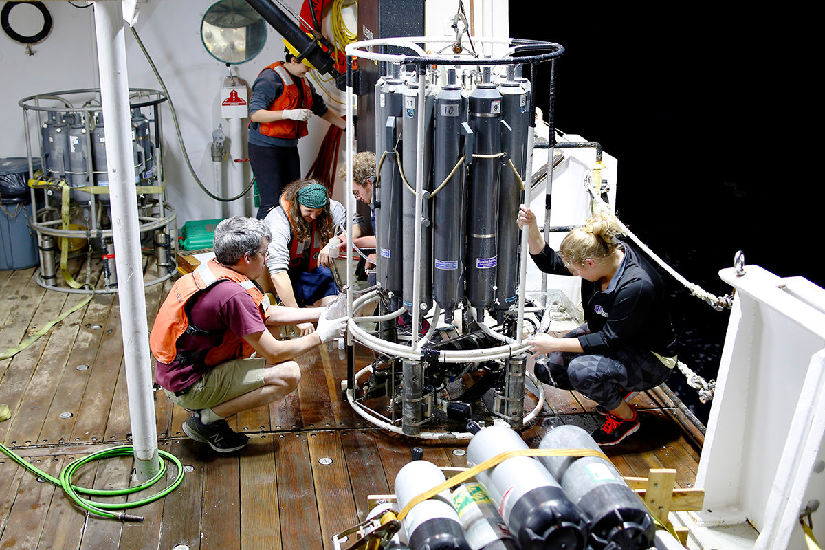 Researchers on the R/V Point Sur manage water sampling equipment. Photo courtesy of Dr. Jason Sylvan.