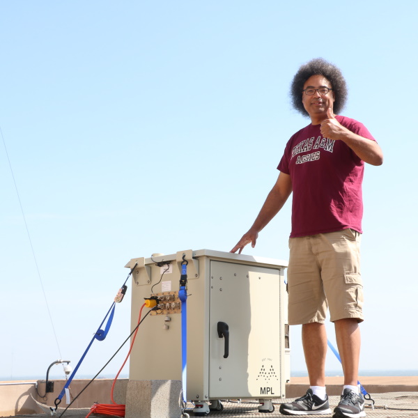Tim Logan with the CACE LIDAR on top of the Eller O&M Building (Photo by Chris Mouchyn)