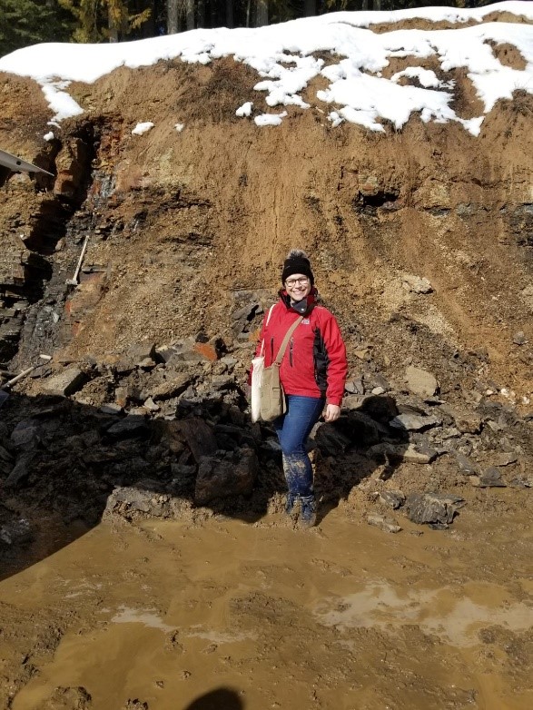 Graduate student, Daianne Höfig, in front of the Clarkia Lake Deposit. (Photo courtesy of Daianne Höfig.)