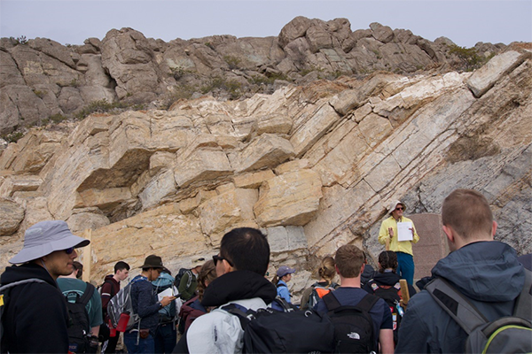 Dr. Mike Pope lectures to students about carbonate stratigraphy in El Paso.
