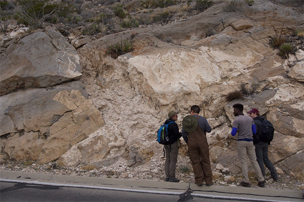 Teaching Assistant David Szafranski instructs students on how to properly measure carbonate stratigraphy in New Mexico. (All photos courtesy of Dr. Nick Perez)