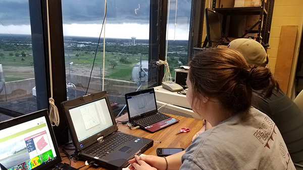 Etten-Bohm and a peer watch data coming in from balloon launch in near storm environment of Franklin tornado. (Photo Courtesy of Montana Etten-Bohm)
