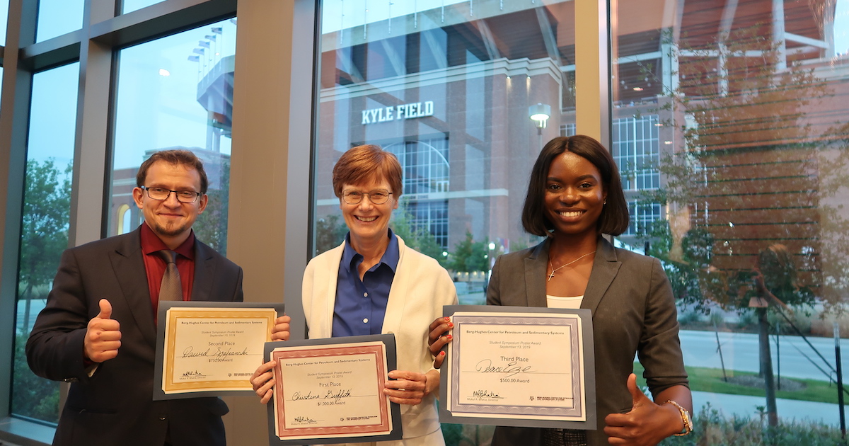 Geology and geophysics graduate students Dawid Szafranski, Christine Griffith, and Peace Eze (left to right) were awarded second, first, and third prizes, respectively, for best research posters at the Berg-Hughes 10th annual Research Symposium. (Photo by Ali Snell.)