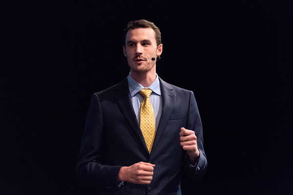 Geography graduate student Crockett Walter presents at the Texas A&M 3MT final competition. (Photo courtesy of Texas A&M OGAPS.)