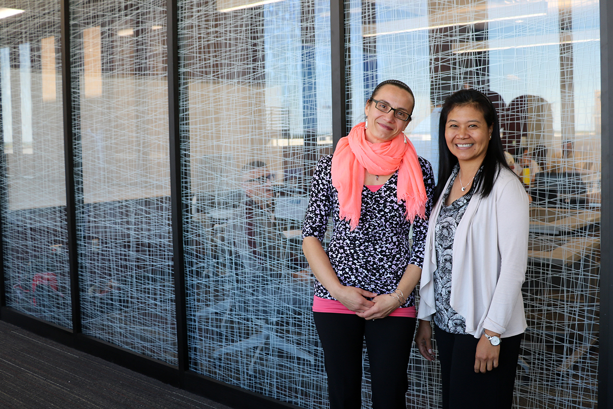 Geri Miller (left) and Canserina Kurnia (right), solutions engineers in Esri's education outreach division, at Texas A&M. (Photo by Leslie Lee.)