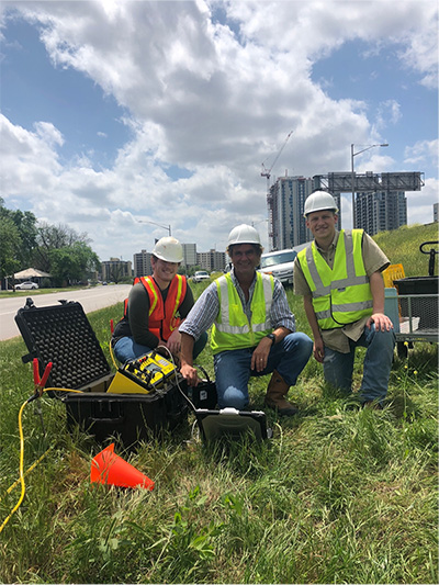 Dr. Mark Everett (center), with Geology & Geophysics students, conducting fieldwork during TxDOT highway construction (Photo credit: Mark Everett)