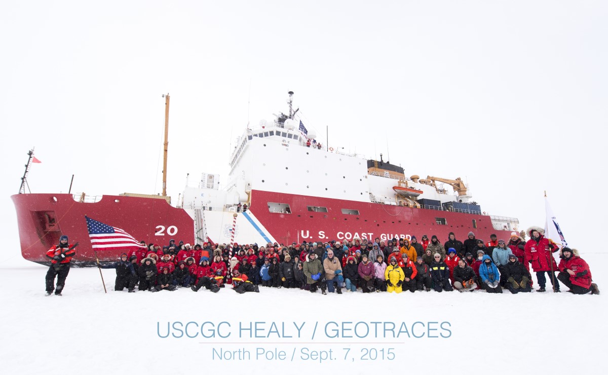 Group photo of the U.S. GEOTRACES team at the North Pole, alongside the crew of the USCGC Healy. Texas A&M assistant professor Fitzsimmons is in the middle of the front row in blue. Photo courtesy of U.S. GEOTRACES and the U.S. Coast Guard. (Photo courtesy of Dr. Jessica Fitzsimmons.)