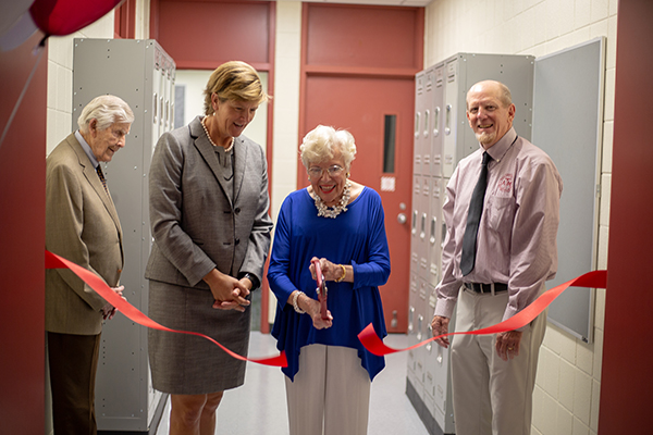 Mrs. Hughes cuts the ribbon for the opening of the Dudley J. Hughes '51 Microscopy Learning Laboratory. (Photo by Chris Mouchyn, Texas A&M Geosciences.)