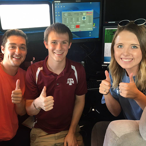 Lawton and fellow Texas A&M meteorology students Ethan Williams (left) and Sarah Randall (right), operating the DOW-8. DOW stands for Doppler on Wheels, a mobile radar truck the department of meteorology used to conduct a field experiment on sea-breeze convection for a few weeks in the summer of 2017. (Photo Courtesy of Quinton Lawton)