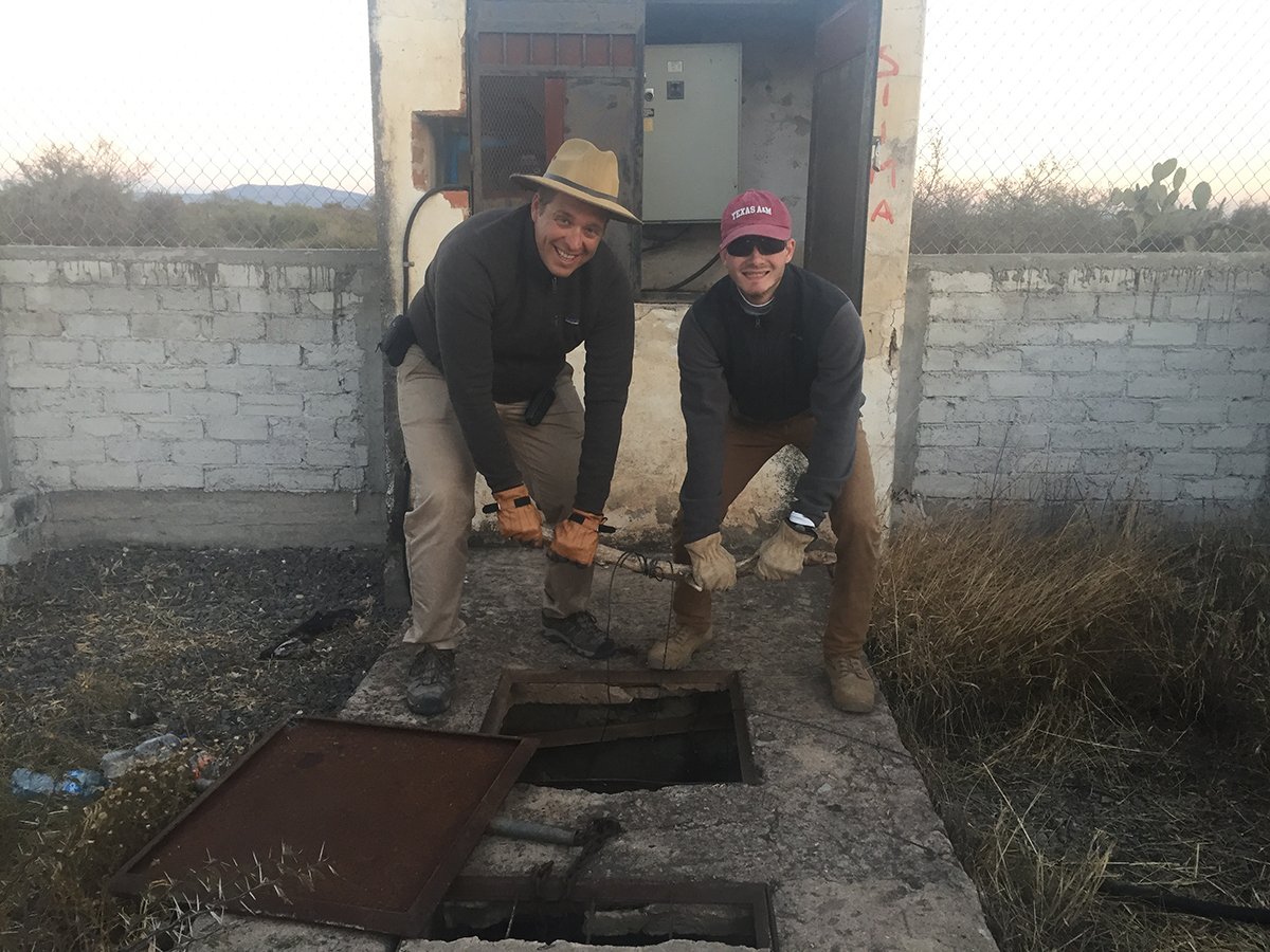 Dr. Peter Knappett and Brian Lynch ’19 used the technology they had available (a log) to rescue their well depth measuring instrument from down a well.