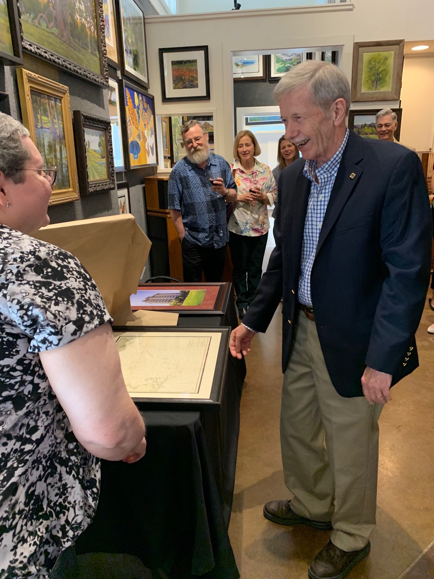 Dr. Shari Yvon-Lewis, head of the Department of Oceanography, showing the retirement gift to Dr. Brooks. (Photo courtesy of Kelsey Dillard.)