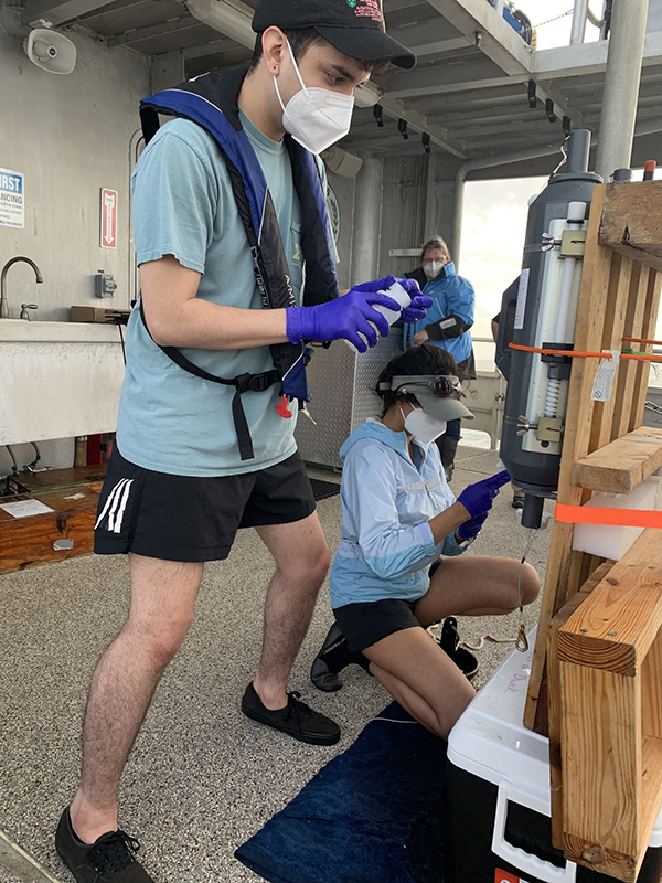 Students taking samples for oceanographic research aboard the R/V Trident. Image Credit: Dr. Yina Liu