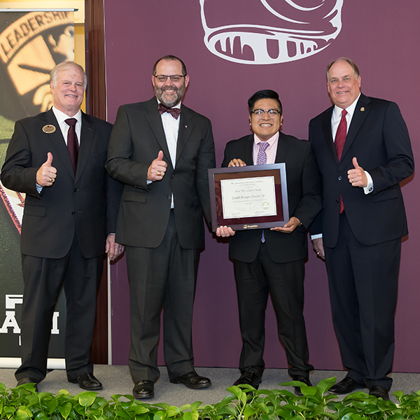 Trujillo receiving a 2019 Buck Weirus Award.