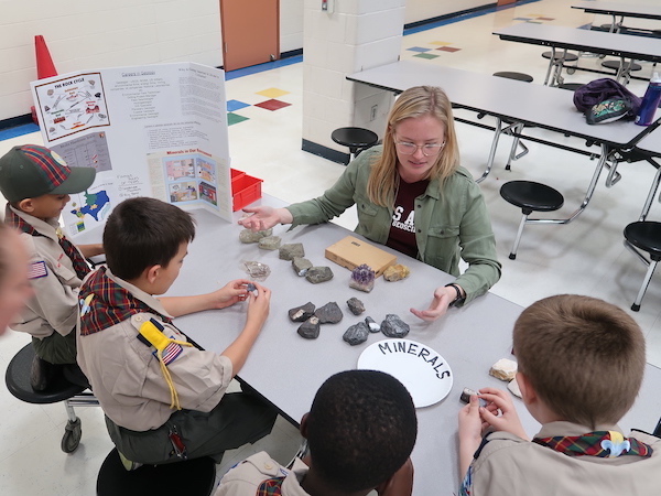 Ali Snell discusses the basics of minerals with Webelos. (Photo courtesy of Andrew Armstrong.)