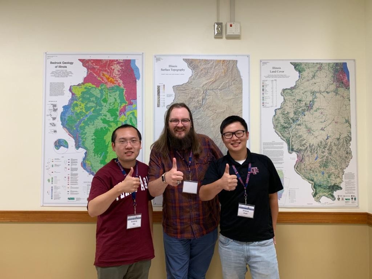 Current Geography graduate students Andong Ma (left), and Jinwoo Park (right), with former Geography graduate student Forrest Bowlick ’16 (center) at the AAG-UCGIS Summer Program. (Photo courtesy of Andong Ma.)