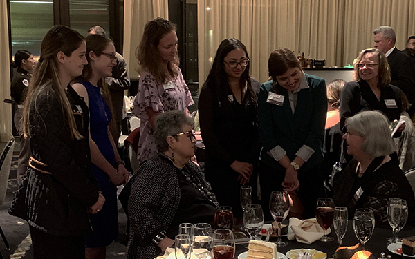 Current geosciences students listen to award recipient Dr. Inda Immega following the event. (Photo by Fred Chester.)