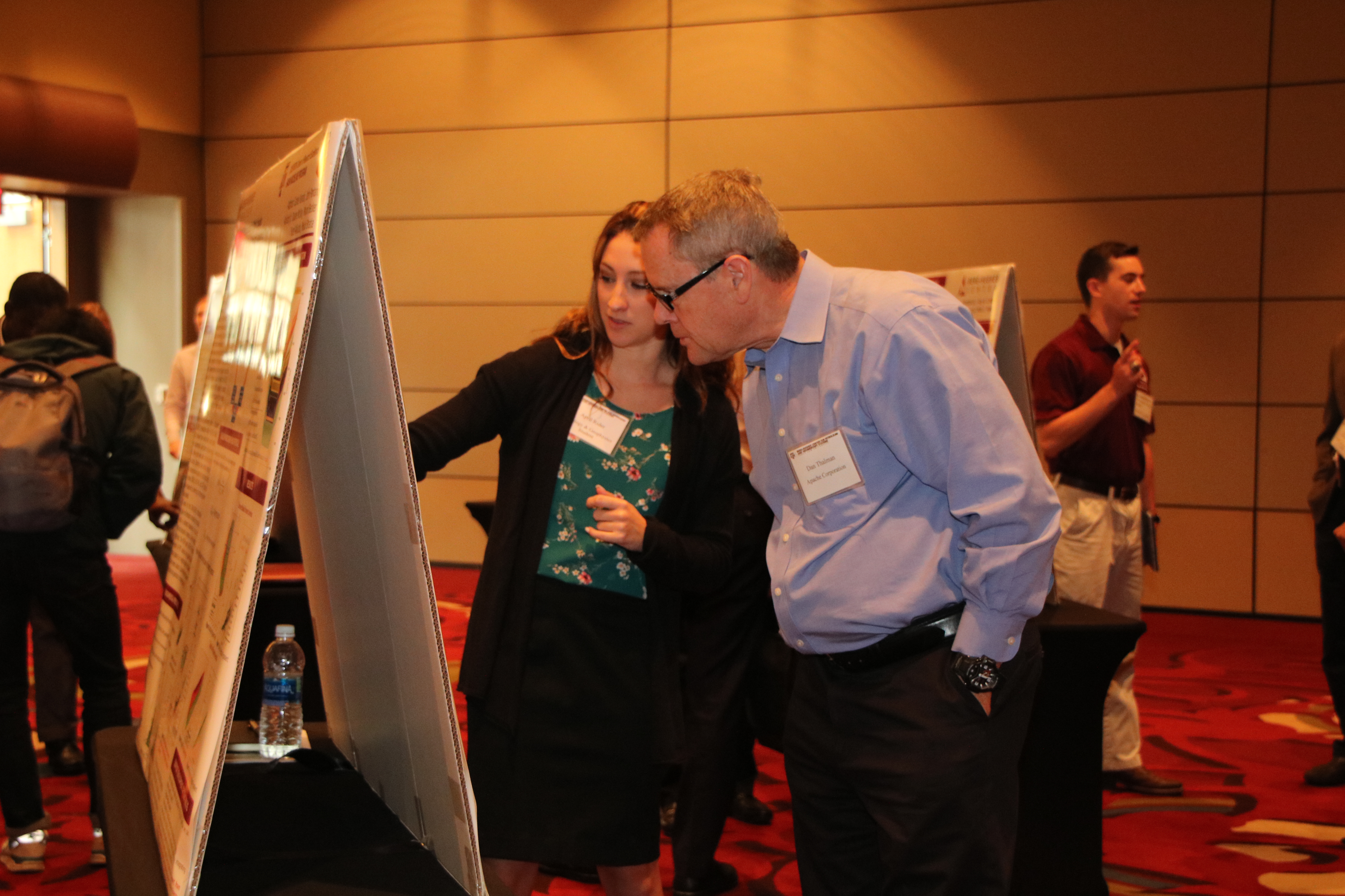 Graduate student, April Rider, presents her poster during the poster session