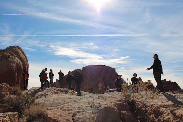 Students stand on outcrop in Valley of Fire State Park, NV. (Photo courtesy of Dr. Brian Balta.)