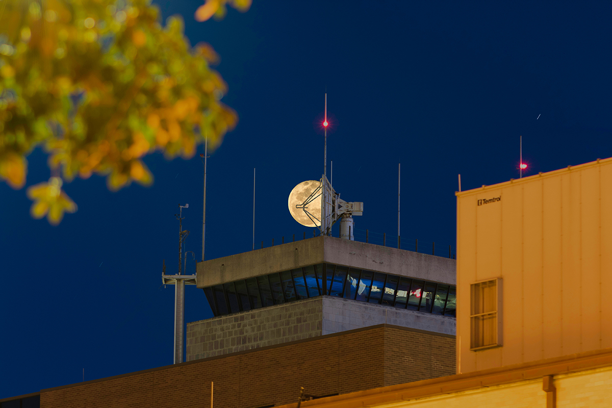 Moon behind the TAMU Aggie Doppler Radar (TAMU-ADRAD). (Photo Courtesy of Stephen Thomas)