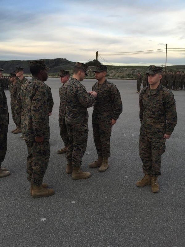 Luis Martinez receiving a promotion to Corporal (E-4). (Photo courtesy of Luis Martinez.)