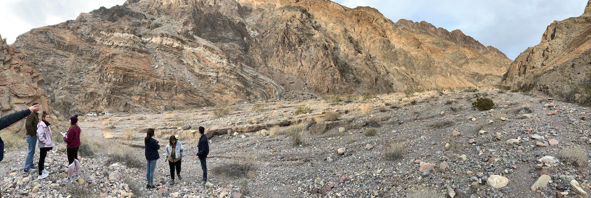 Students take in an overturned fold limb located in the mouth of Titus Canyon, Death Valley National Park, CA. (Photo courtesy of Dr. Brian Balta.)