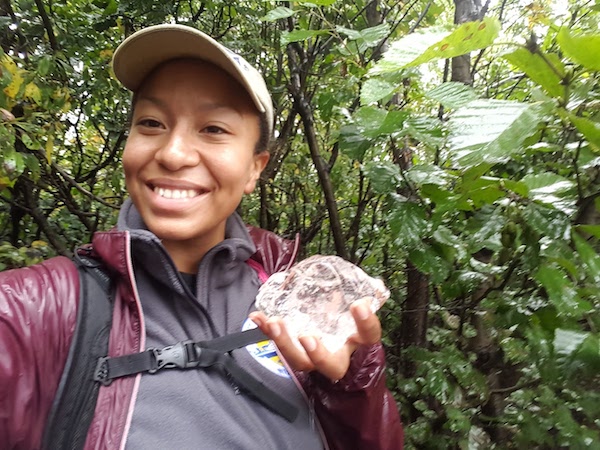 Raquel holding a piece of a glacier at Kenai Fjords National Park, Alaska. This field trip was part of the STEM SEAS 2016 expedition. (Photo courtesy of Dr. Bryant.)