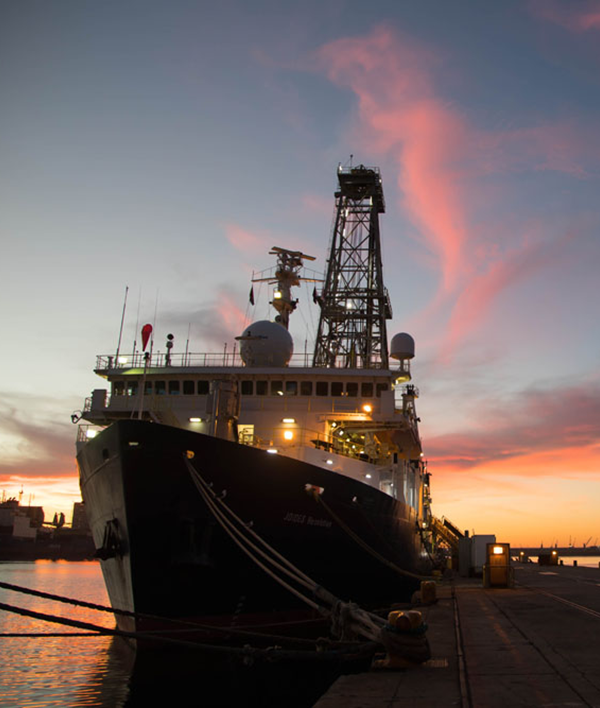 The JOIDES Resolution docked in Cape Town at sunset. (Credit: Sandra Herrmann, IODP JRSO)