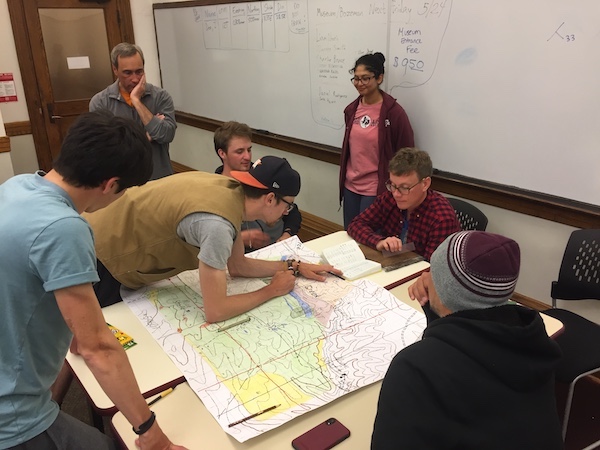 Students compiling field data in the classroom overseen by TA, Ryan Elmore, and Dr. Brent Miller. Photo by Michelle Cherpa.