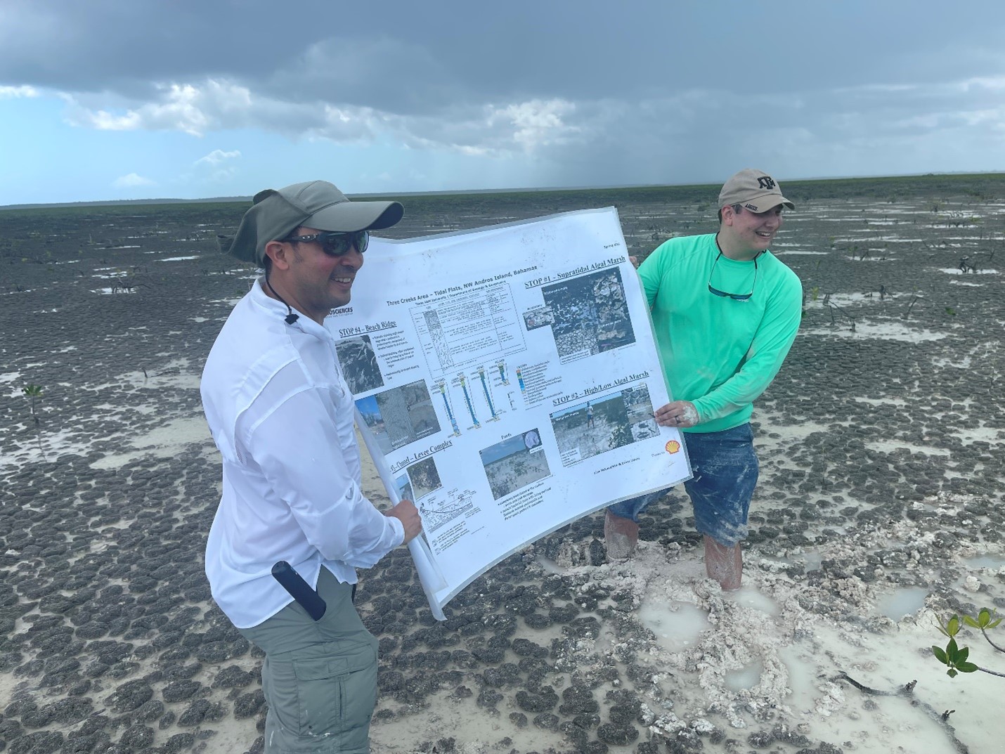 Dr. Juan Carlos Laya and Dr. Cameron Manche discuss carbonate mud deposition in the inland supratidal algal marsh on the leeward side of Andros Island. Photo by Dennis Zakowicz.