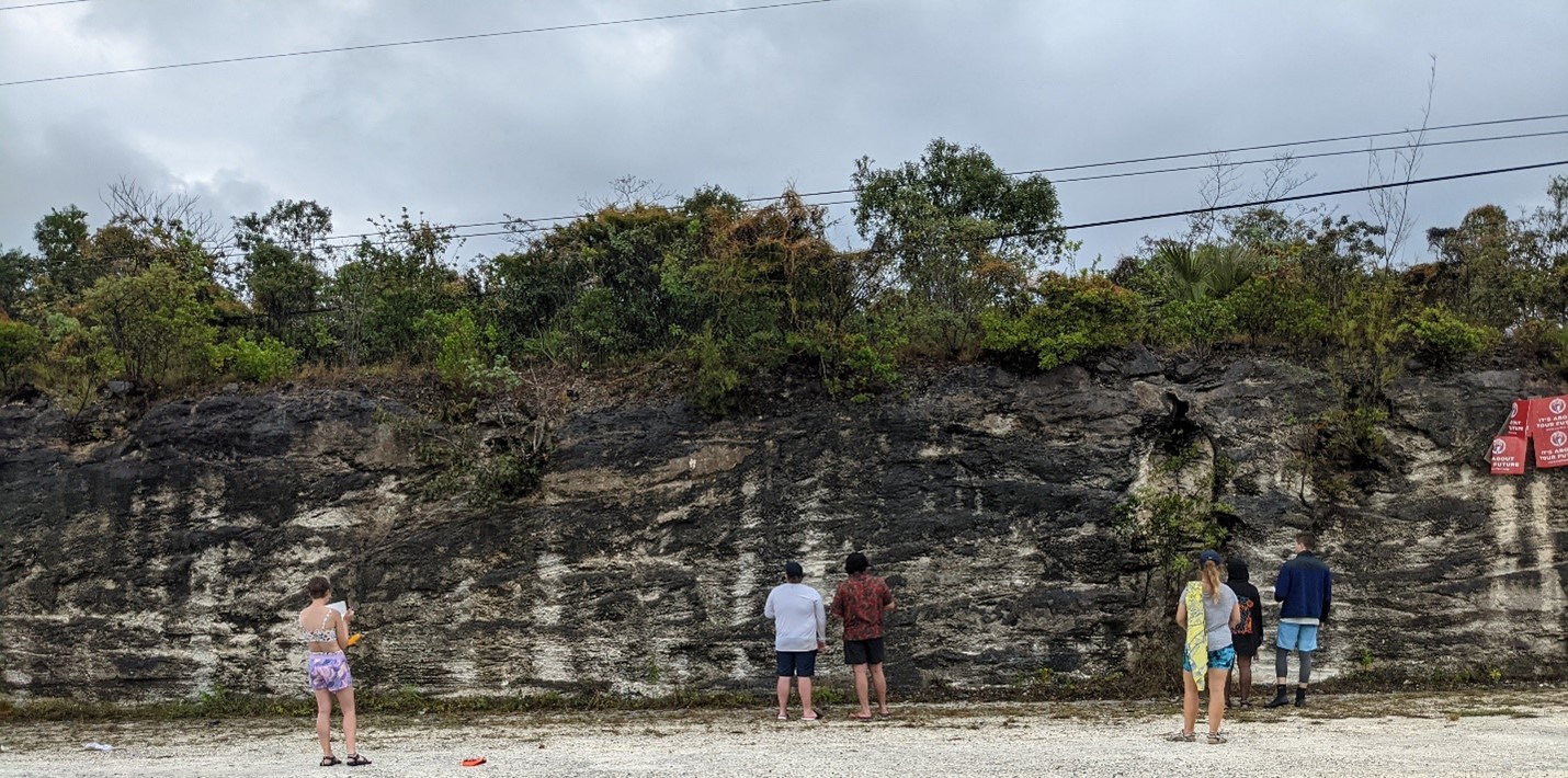 Students describe a Pleistocene outcrop of the paleo-shoreline from 115,000 to 120,000 years ago. Students from left to right: Milly Hencey, Cameron Smolik, Sam Queiroga, Abbie Nye (Forfar Field Station Environmental Educator), Kari Dawson (Forfar Field Station Environmental Educator), and Dennis Zakowicz.