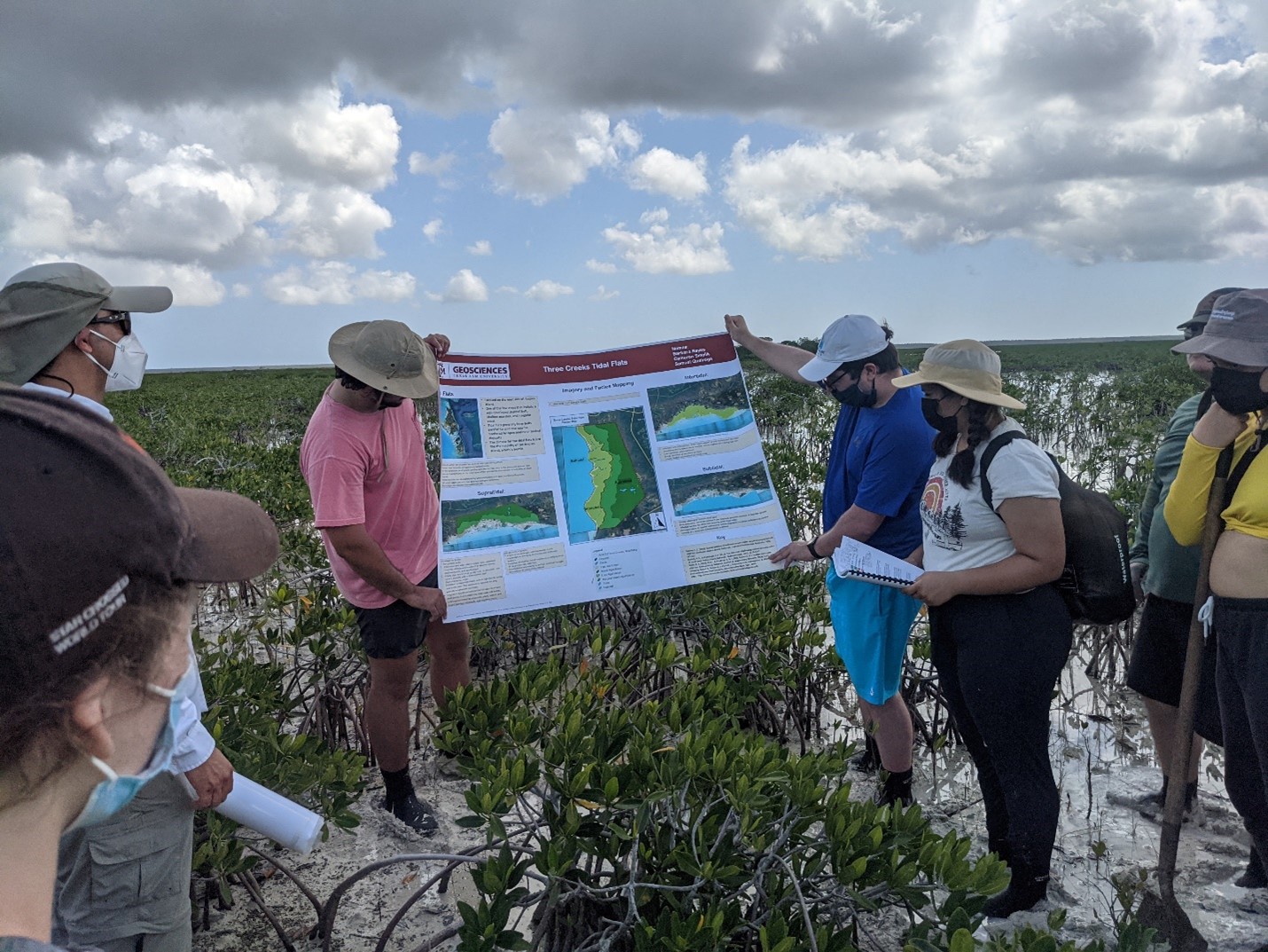 Geology undergraduate students (from left to right) Sam Queiroga, Cameron Smolik, and Barbara Reyes present their poster on the Three Creeks Tidal Flats.